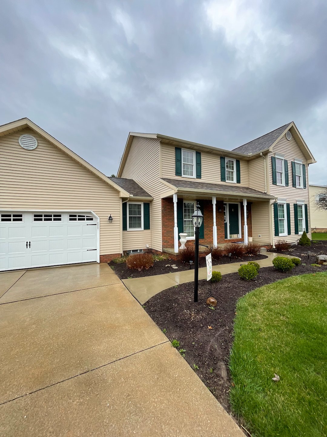  Thorough House Wash and Pressure Washing on a vinyl sided home, walkway and driveway in Canton, Oh. 