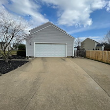 Professional-Pressure-Washing-and-Soft-Washing-on-a-vinyl-sided-home-walkway-and-driveway-in-Sheffield-Lake-Oh 1