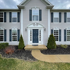 Professional-Pressure-Washing-and-Soft-Washing-on-a-vinyl-sided-home-walkway-and-driveway-in-Sheffield-Lake-Oh 2