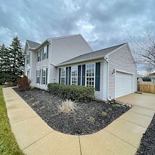 Professional-Pressure-Washing-and-Soft-Washing-on-a-vinyl-sided-home-walkway-and-driveway-in-Sheffield-Lake-Oh 4